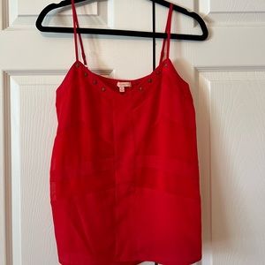 Women red blouse gold detail